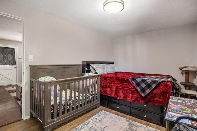 bedroom with wood finished floors