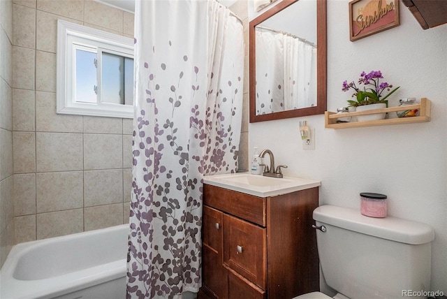 bathroom with toilet, vanity, and shower / bath combo with shower curtain