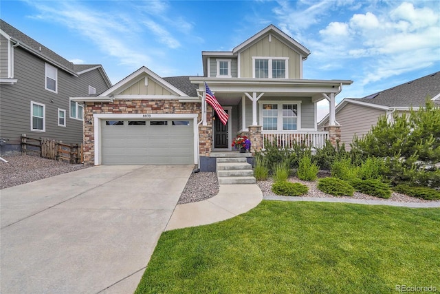8839 Culebra St, Arvada, CO 80007 - craftsman inspired home with board and batten siding, covered porch, concrete driveway, and a front lawn
