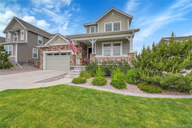 8839 Culebra St, Arvada, CO 80007 - craftsman inspired home featuring board and batten siding, a porch, stone siding, driveway, and a garage