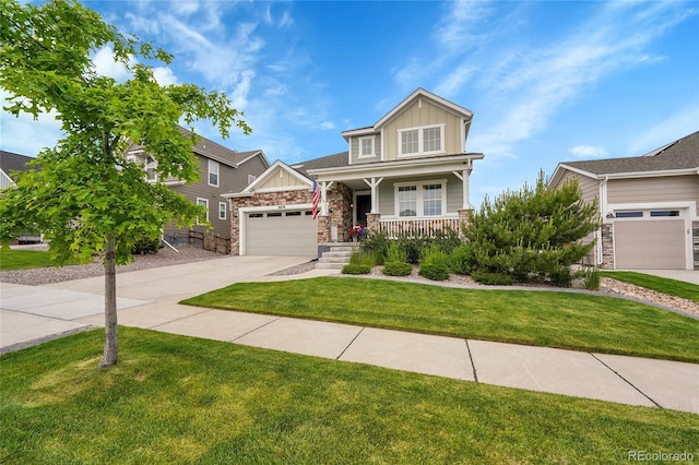 8839 Culebra St, Arvada, CO 80007 - craftsman-style house with board and batten siding, a porch, stone siding, driveway, and a front yard