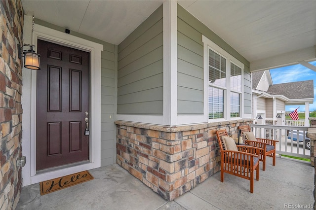 8839 Culebra St, Arvada, CO 80007 - property entrance with a porch and stone siding