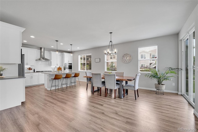 8839 Culebra St, Arvada, CO 80007 - dining space featuring recessed lighting, light wood finished floors, and a chandelier