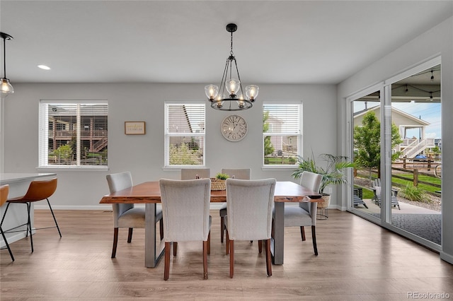 8839 Culebra St, Arvada, CO 80007 - dining room with a chandelier, light wood-style flooring, and recessed lighting