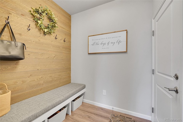 8839 Culebra St, Arvada, CO 80007 - mudroom featuring light wood finished floors and wood walls