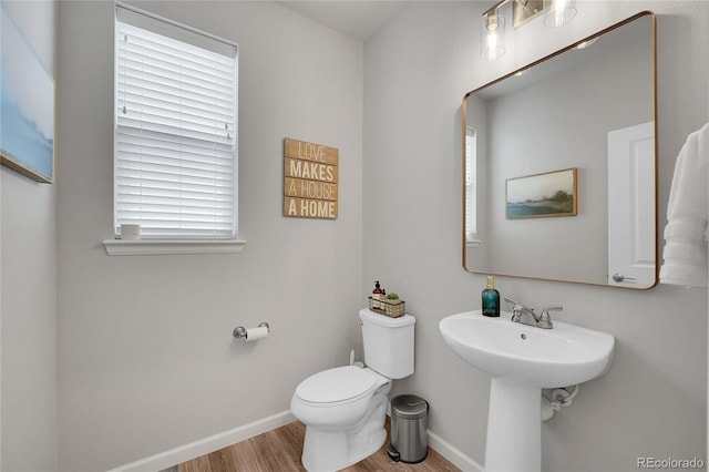 8839 Culebra St, Arvada, CO 80007 - bathroom featuring wood finished floors and toilet