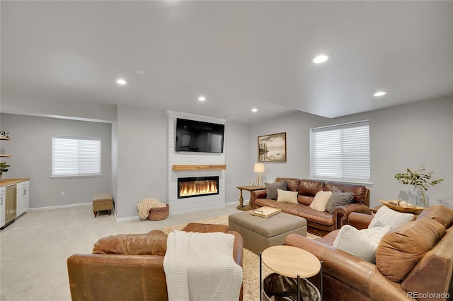 8839 Culebra St, Arvada, CO 80007 - living room featuring light carpet, recessed lighting, and a large fireplace