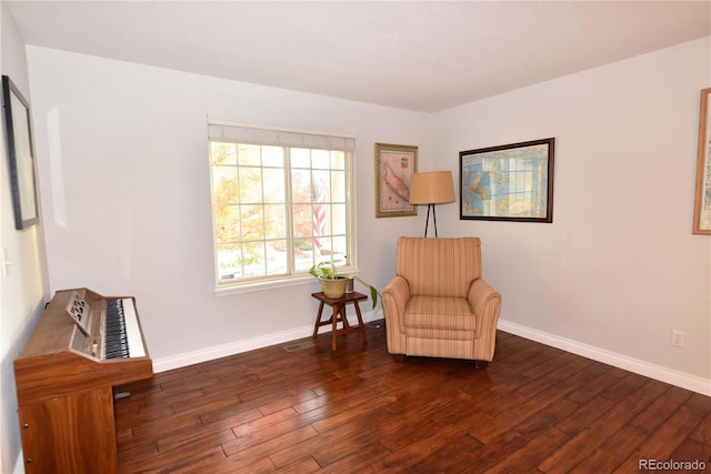 sitting room featuring dark hardwood / wood-style flooring