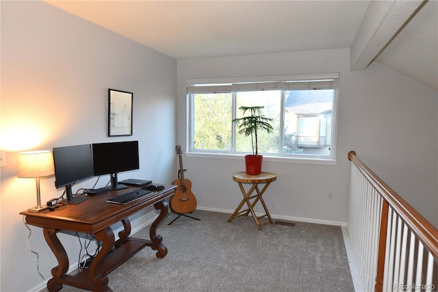 office space with carpet flooring and lofted ceiling with beams