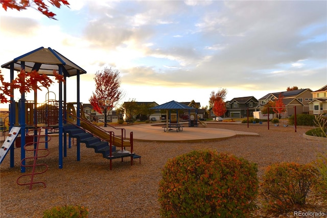 playground at dusk featuring a gazebo