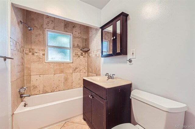 full bathroom with tile patterned floors, toilet, vanity, and tiled shower / bath