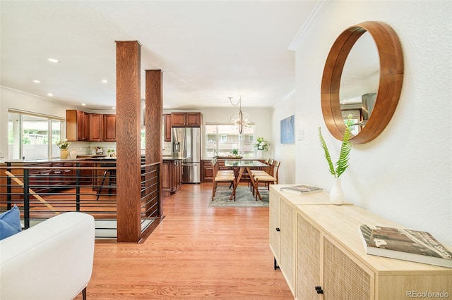 3025 S Norman Ct, Denver, CO 80224 - hallway featuring ornamental molding, light wood-style flooring, a chandelier, and recessed lighting