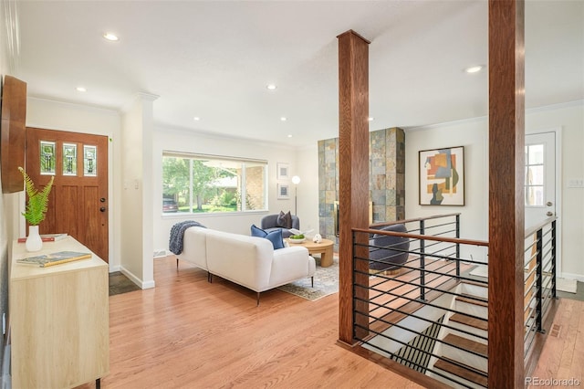 3025 S Norman Ct, Denver, CO 80224 - living area featuring ornamental molding, light wood-style floors, healthy amount of natural light, and recessed lighting