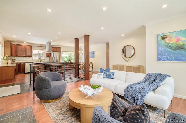3025 S Norman Ct, Denver, CO 80224 - living area with ornamental molding, recessed lighting, and light wood-style floors