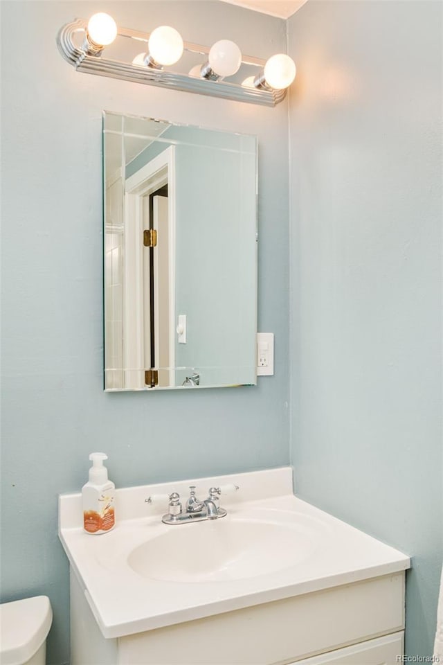 3025 S Norman Ct, Denver, CO 80224 - bathroom featuring vanity and toilet