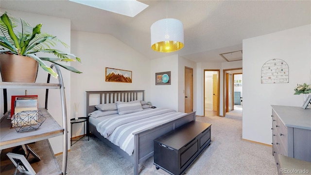 carpeted bedroom featuring lofted ceiling with skylight