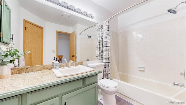 full bathroom featuring vanity, toilet, and shower / bath combo with shower curtain