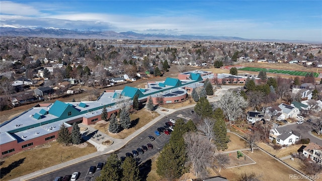 birds eye view of property featuring a mountain view