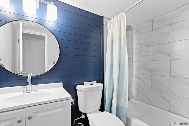 bathroom featuring toilet, vanity, and shower / tub combo