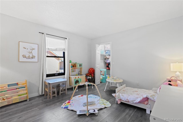 bedroom featuring a closet and wood finished floors