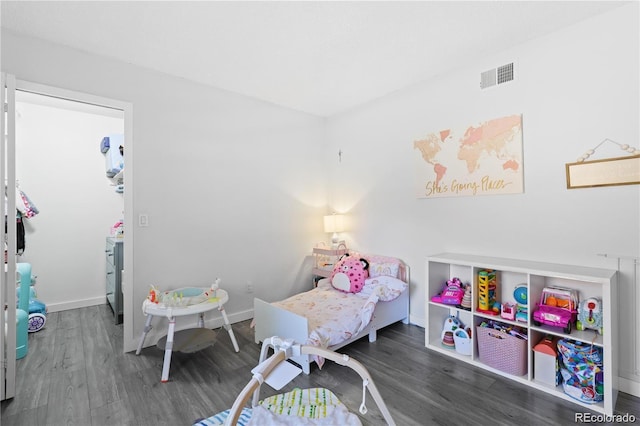 recreation room with wood finished floors, visible vents, and baseboards