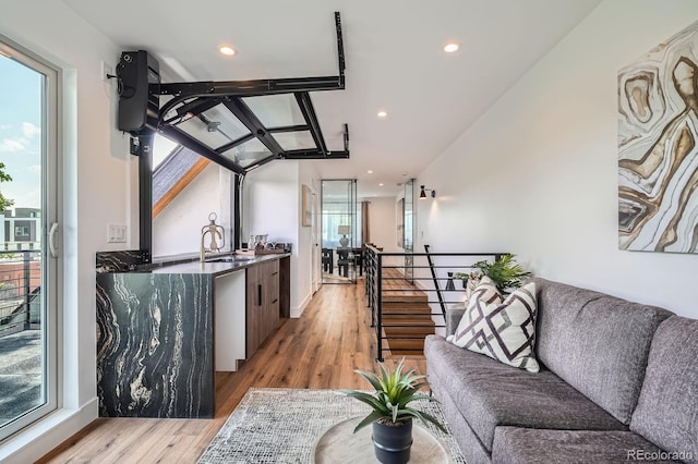 4476 Utica St, Denver, CO 80212 - living room with light wood finished floors, plenty of natural light, recessed lighting, and stairs