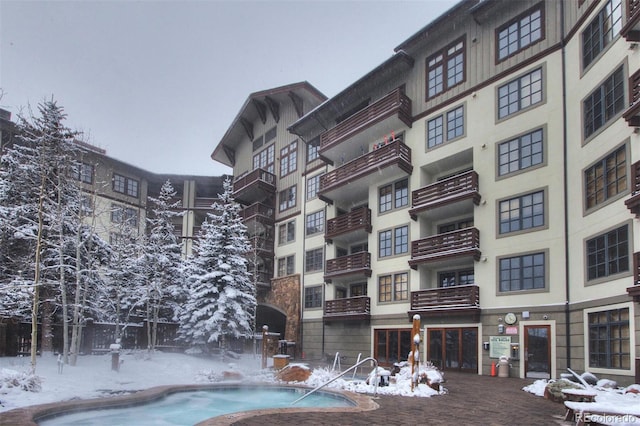 view of snow covered pool