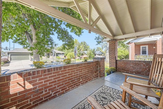 view of patio / terrace featuring a garage