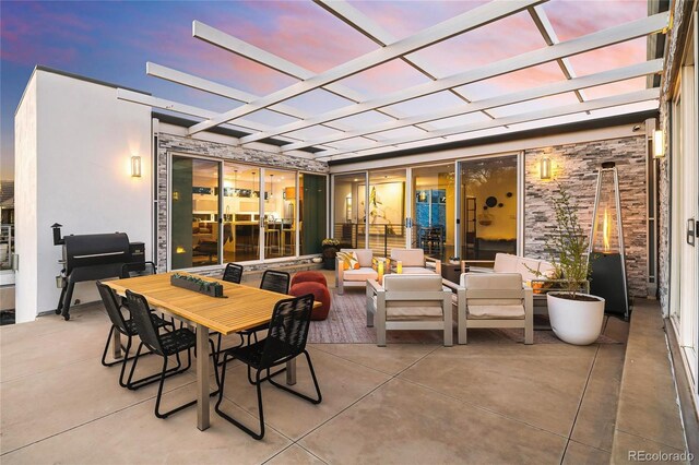 view of patio / terrace with a pergola, an outdoor hangout area, and a grill