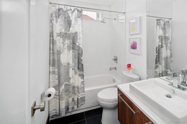 bathroom with vanity, toilet, tile patterned flooring, and shower / tub combo