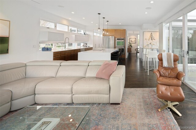 living room featuring recessed lighting and dark wood finished floors