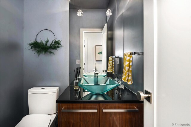 half bath with vanity and toilet