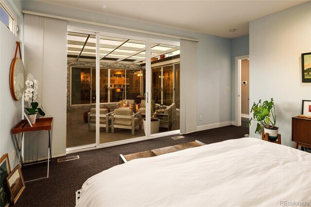 carpeted bedroom with visible vents and baseboards