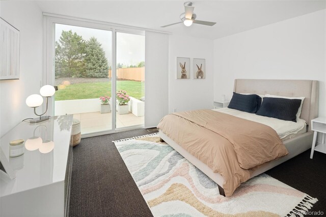 carpeted bedroom featuring ceiling fan and access to exterior