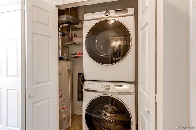 2870 S Ursula St, Aurora, CO 80014 - laundry area with stacked washer / drying machine, laundry area, and gas water heater