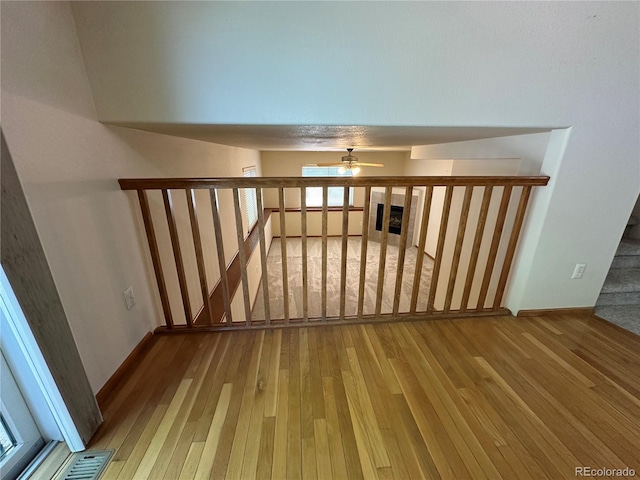 374 Krypton Ct, Loveland, CO 80537 - spare room with hardwood / wood-style floors, a ceiling fan, and baseboards