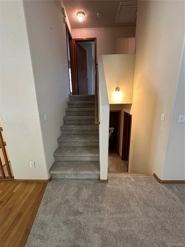 374 Krypton Ct, Loveland, CO 80537 - staircase with wood finished floors and baseboards