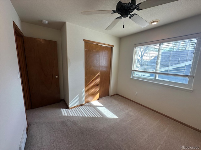 374 Krypton Ct, Loveland, CO 80537 - unfurnished bedroom featuring a closet, carpet floors, baseboards, and ceiling fan