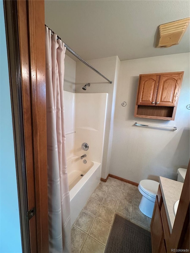 374 Krypton Ct, Loveland, CO 80537 - bathroom featuring toilet, vanity, tile patterned flooring, baseboards, and shower / bath combo with shower curtain