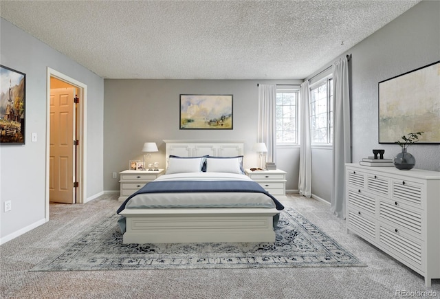 carpeted bedroom with a textured ceiling