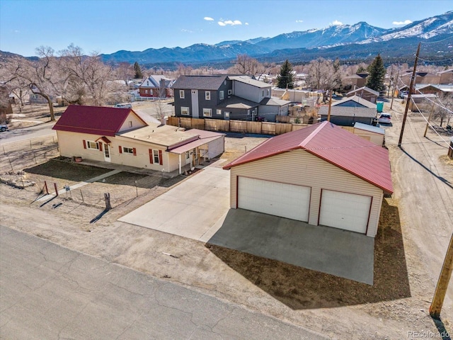 birds eye view of property featuring a mountain view