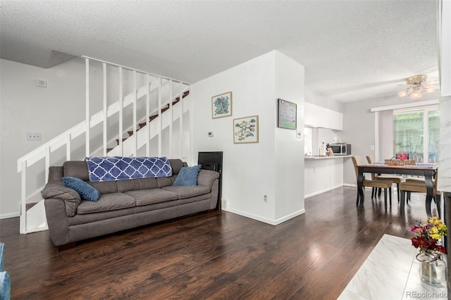 1977 S Oakland Way, Aurora, CO 80014 - living room with stairway, wood finished floors, a textured ceiling, and ceiling fan