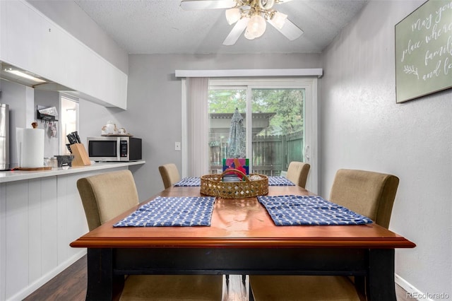 1977 S Oakland Way, Aurora, CO 80014 - dining space with dark wood finished floors, ceiling fan, and a textured ceiling