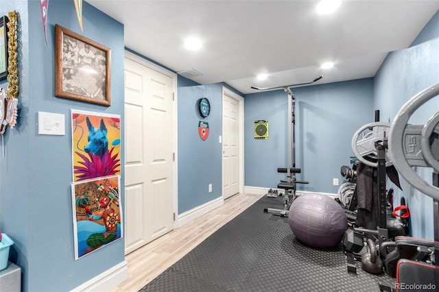 1977 S Oakland Way, Aurora, CO 80014 - workout room featuring wood finished floors and recessed lighting