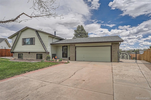 split level home featuring a garage, brick siding, fence, a front lawn, and concrete driveway