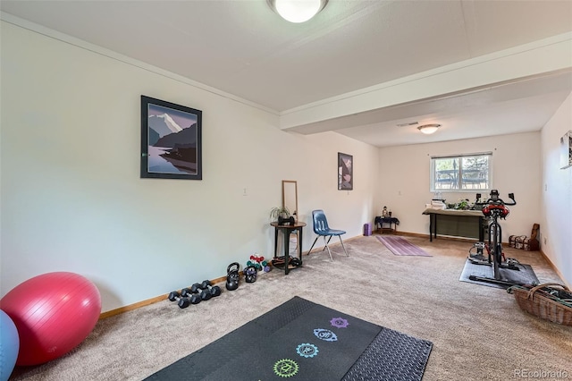 workout room featuring carpet floors and baseboards
