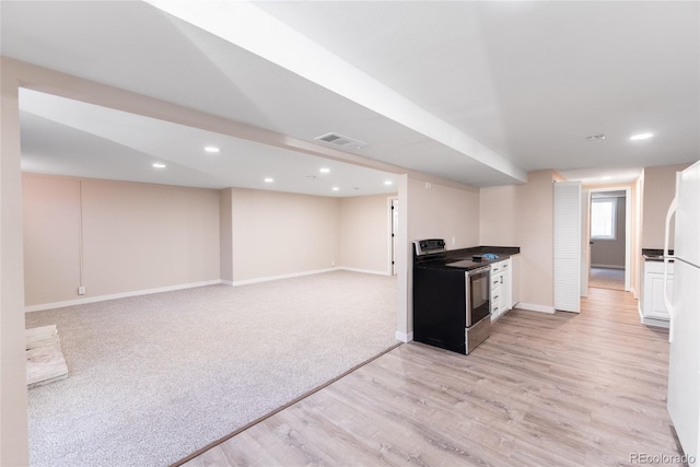 kitchen with recessed lighting, visible vents, light wood-type flooring, baseboards, and stainless steel electric range oven