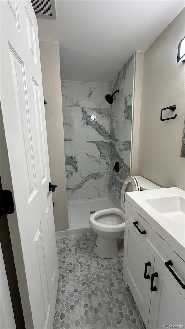5384 S Datura St, Littleton, CO 80120 - full bathroom with vanity and a marble finish shower