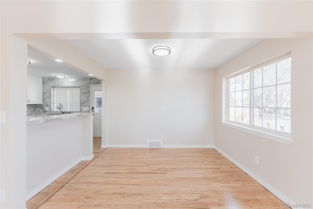 5384 S Datura St, Littleton, CO 80120 - unfurnished dining area with light wood-type flooring