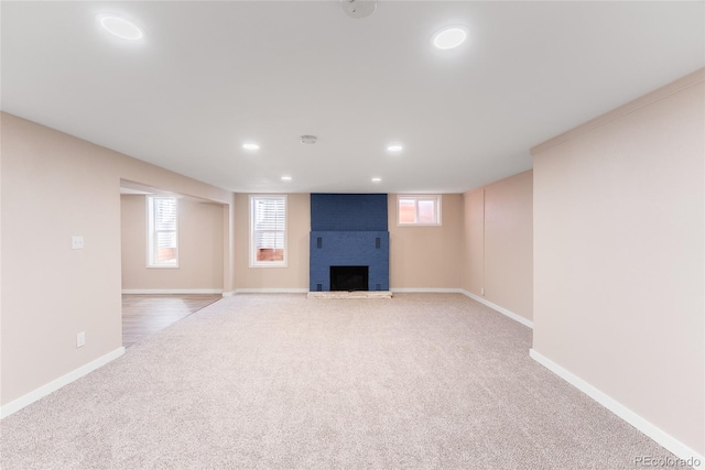 5384 S Datura St, Littleton, CO 80120 - basement with carpet floors, a brick fireplace, and recessed lighting
